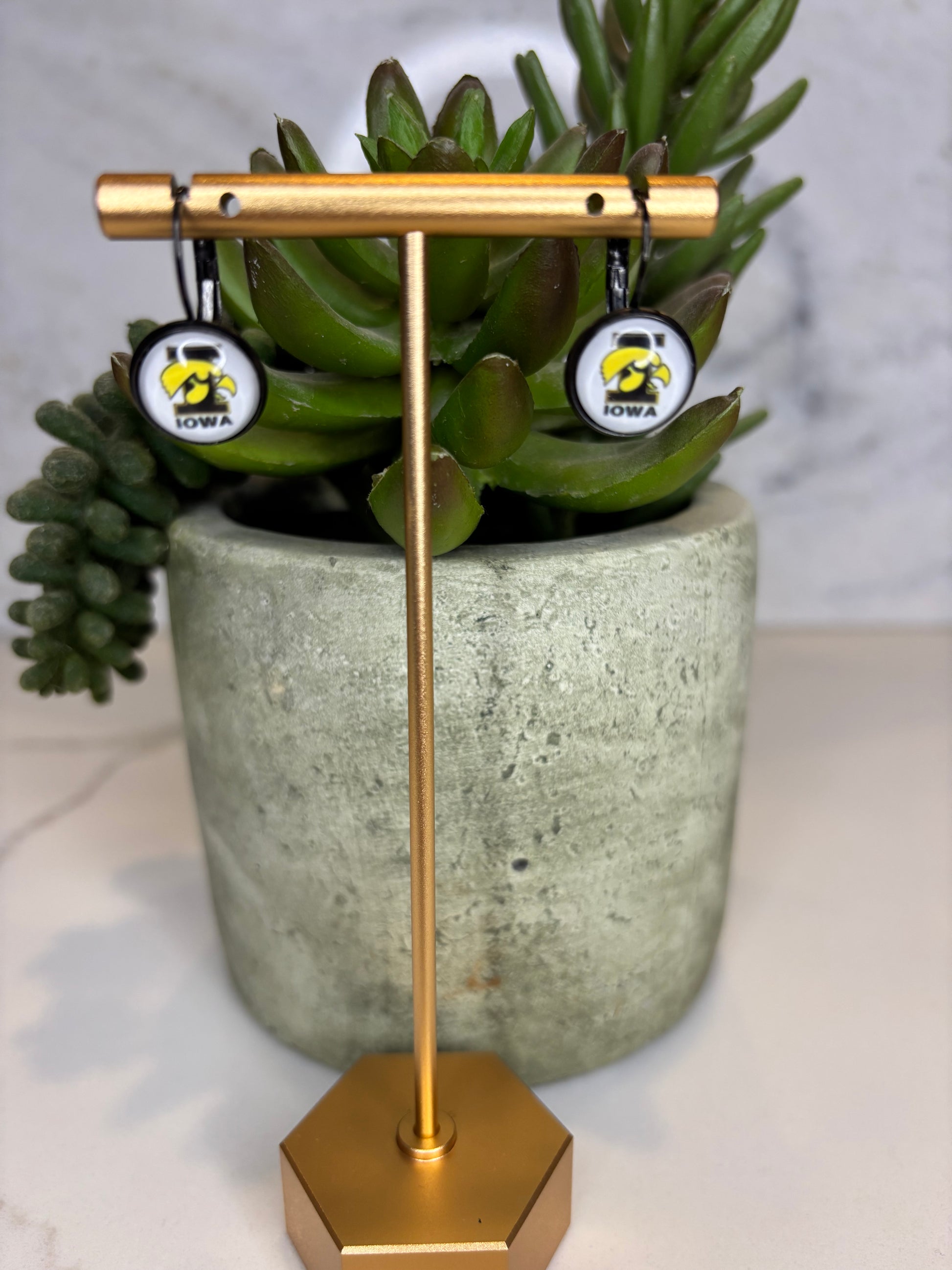 Hawkeye Huggie earrings
