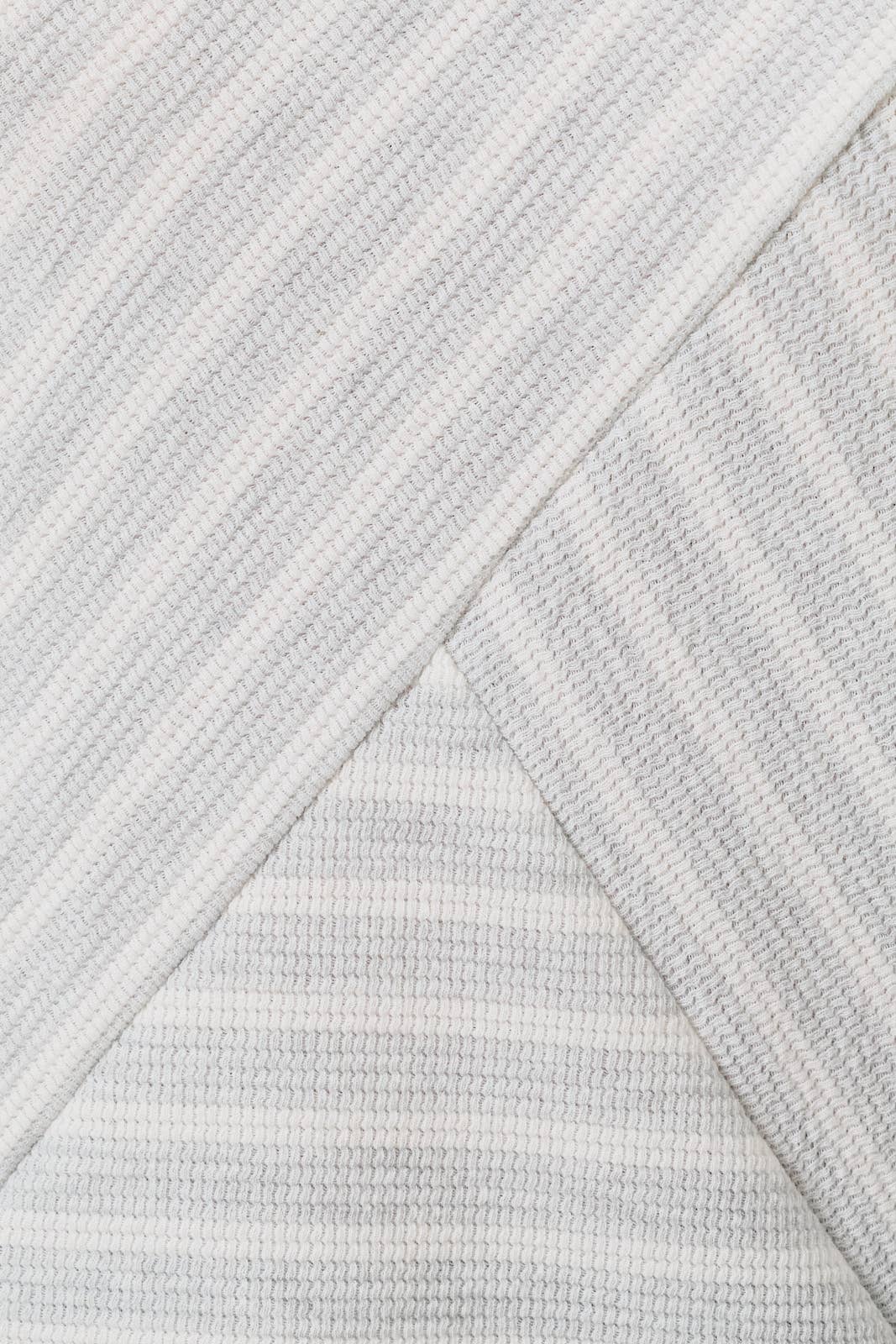 CREW NECK SLEEVELESS DIAGONAL PANEL STRIPE TOP