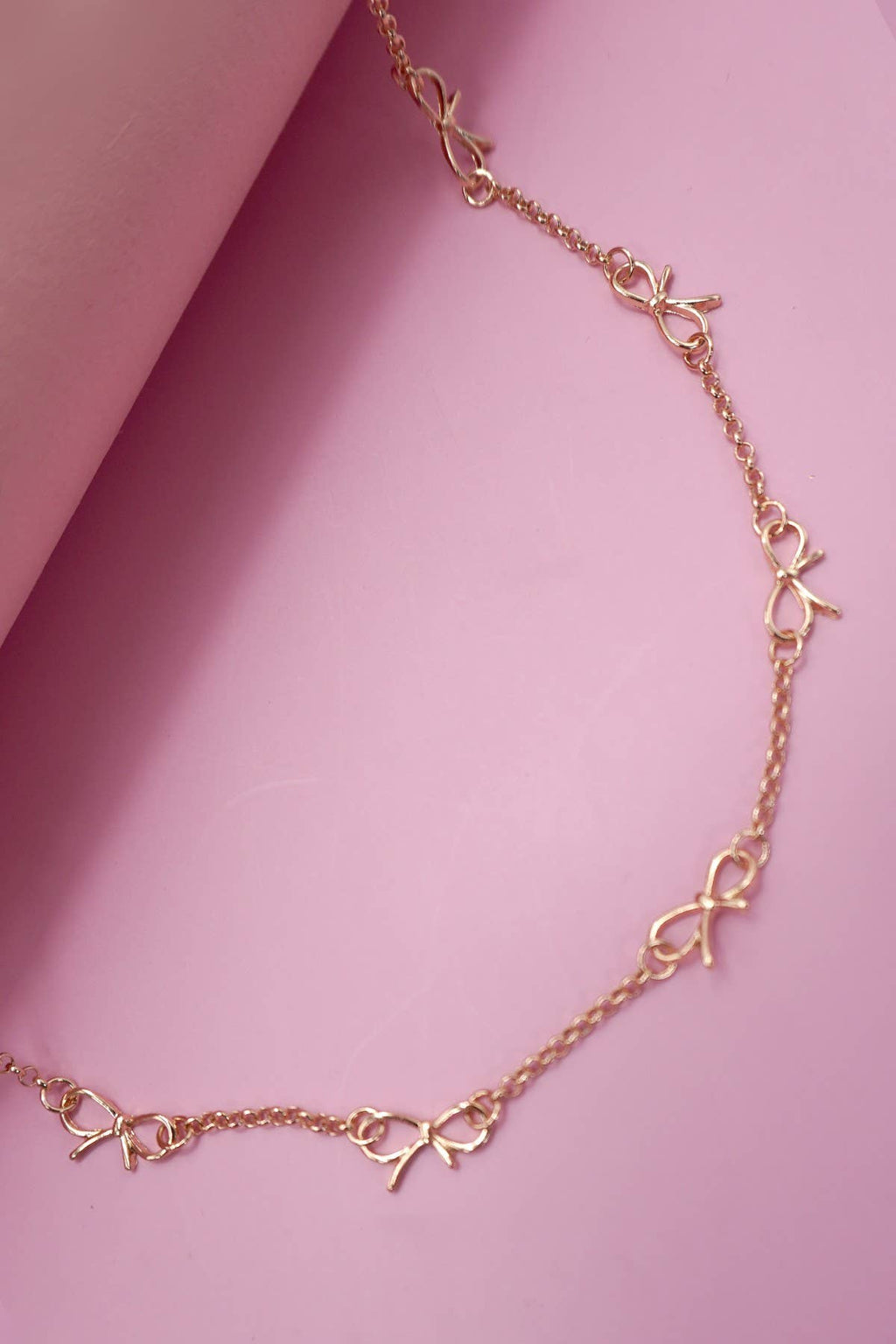 CUTOUT BOW NECKLACE